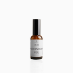 50ml Afternoon Veil fragrance mist in amber glass bottle with black cap and soft grey-white label, photographed on white background