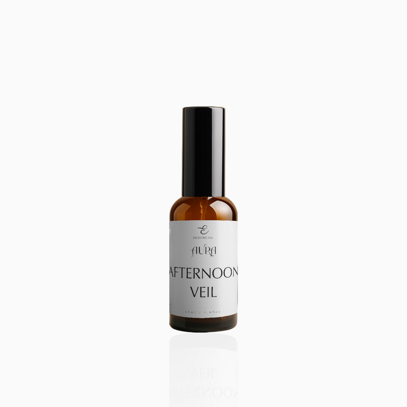 50ml Afternoon Veil fragrance mist in amber glass bottle with black cap and soft grey-white label, photographed on white background