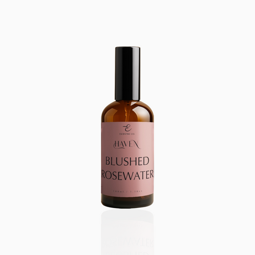 100ml Blushed Rosewater fragrance mist in amber glass bottle with black cap and dusty rose label, photographed on white background