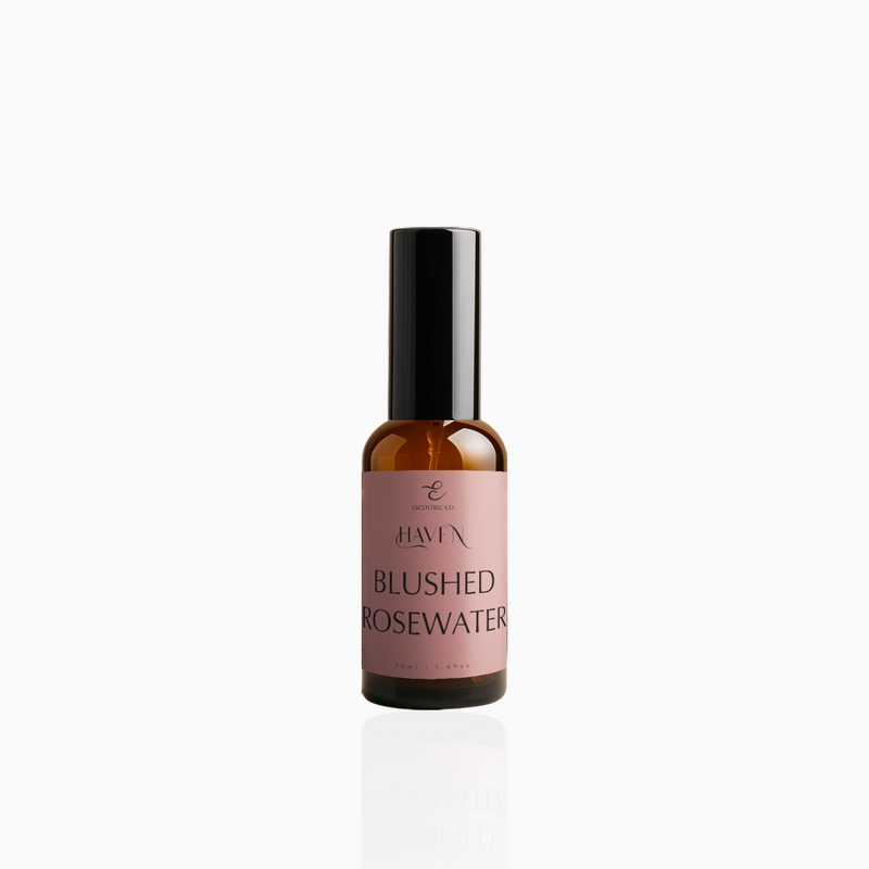 50ml Blushed Rosewater fragrance mist in amber glass bottle with black cap and dusty rose label, photographed on white background