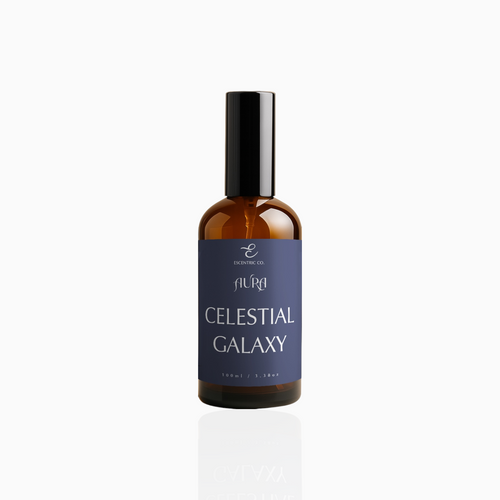 100ml Celestial Galaxy fragrance mist in amber glass bottle with black cap and deep indigo label, photographed on white background