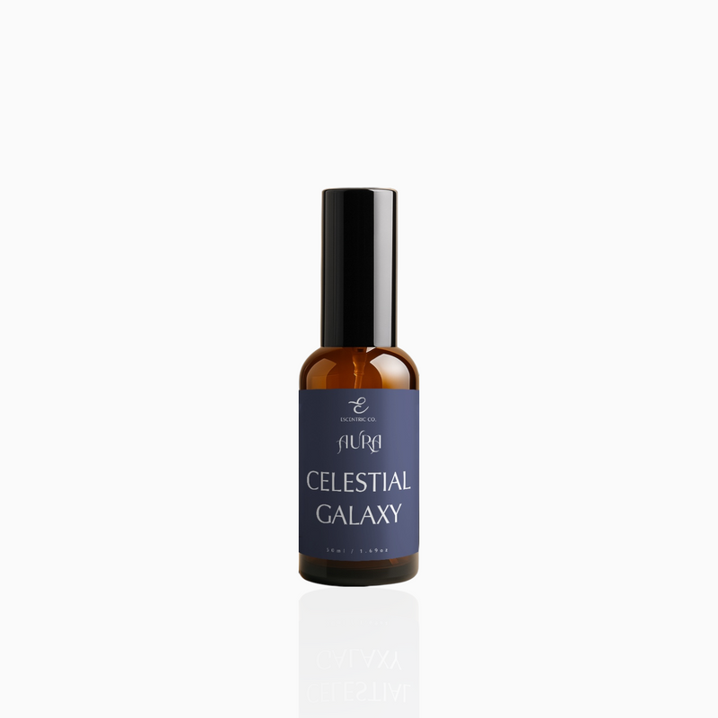 50ml Celestial Galaxy fragrance mist in amber glass bottle with black cap and deep indigo label, photographed on white background