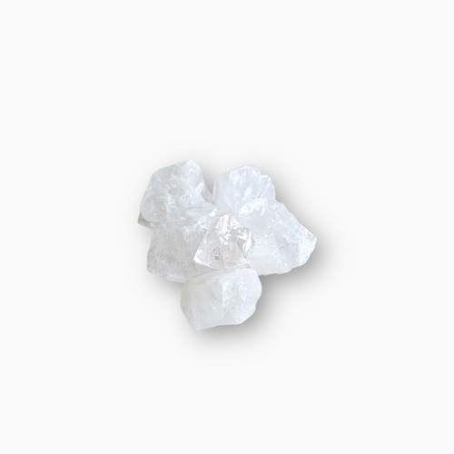 Group of raw Clear Quartz crystals with transparent, icy textures arranged on a clean white background.