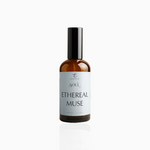 100ml Ethereal Muse fragrance mist in amber glass bottle with black cap and airy powder blue label, photographed on white background