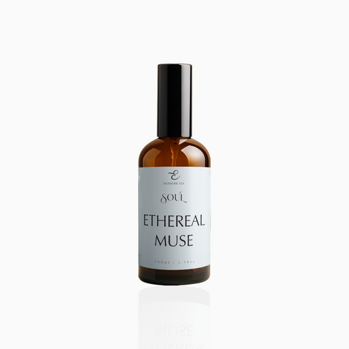 100ml Ethereal Muse fragrance mist in amber glass bottle with black cap and airy powder blue label, photographed on white background