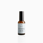 50ml Ethereal Muse fragrance mist in amber glass bottle with black cap and airy powder blue label, photographed on white background