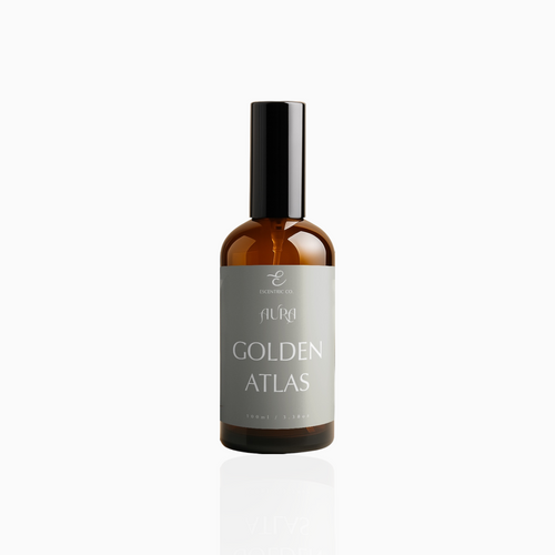 100ml Golden Atlas fragrance mist in amber glass bottle with black cap and muted taupe-grey label, photographed on white background