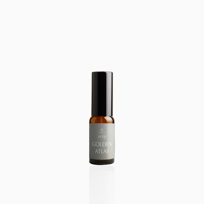 15ml Golden Atlas fragrance mist in amber glass bottle with black cap and muted taupe-grey label, photographed on white background