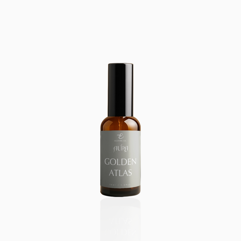 50ml Golden Atlas fragrance mist in amber glass bottle with black cap and muted taupe-grey label, photographed on white background