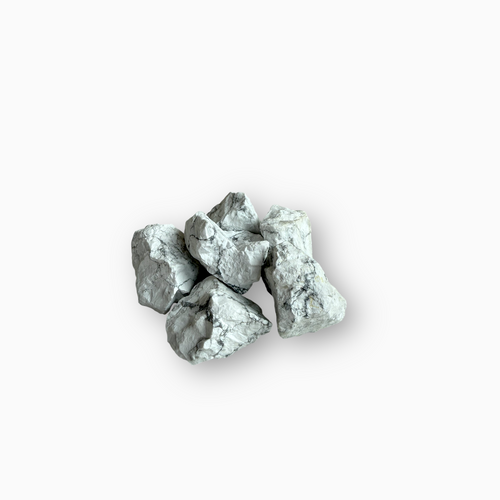 Cluster of raw Howlite stones featuring a white base with subtle grey veining, displayed against a clean white background.
