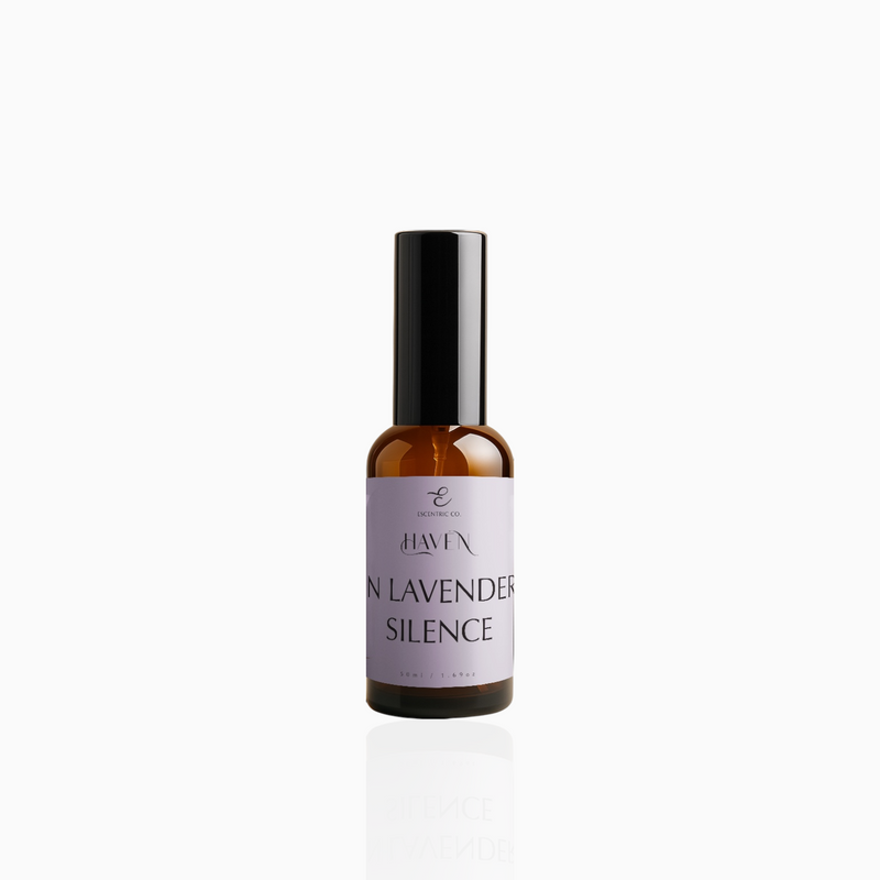 50ml In Lavender Silence fragrance mist in amber glass bottle with black cap and soft lavender label, photographed on white background