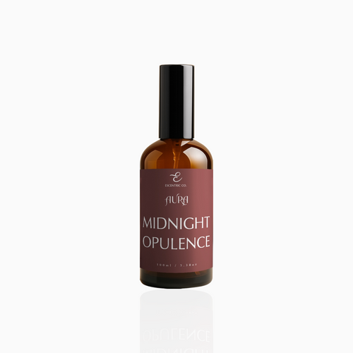 100ml Midnight Opulence fragrance mist in amber glass bottle with black cap and deep crimson label, photographed on white background