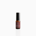 15ml Midnight Opulence fragrance mist in amber glass bottle with black cap and deep crimson label, photographed on white background