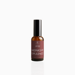50ml Midnight Opulence fragrance mist in amber glass bottle with black cap and deep crimson label, photographed on white background