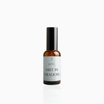 50ml Mist in Meadow fragrance mist in amber glass bottle with black cap and pale mint green label, photographed on white background