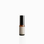 15ml Suite Serenity fragrance mist in amber glass bottle with black cap and soft taupe label, photographed on white background