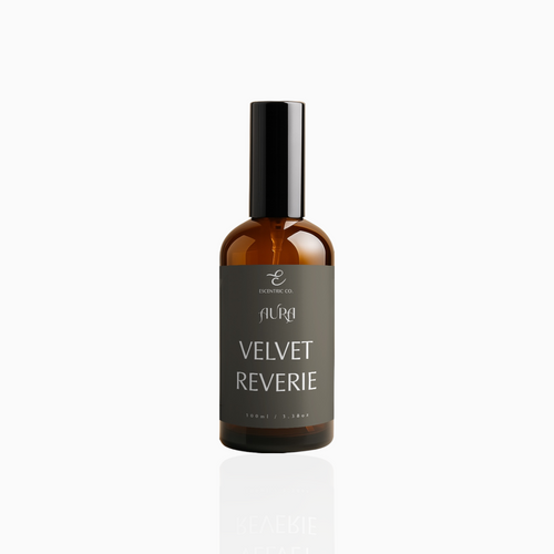100ml Velvet Reverie fragrance mist in amber glass bottle with black cap and deep grey label, photographed on white background