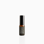 15ml Velvet Reverie fragrance mist in amber glass bottle with black cap and deep grey label, photographed on white background