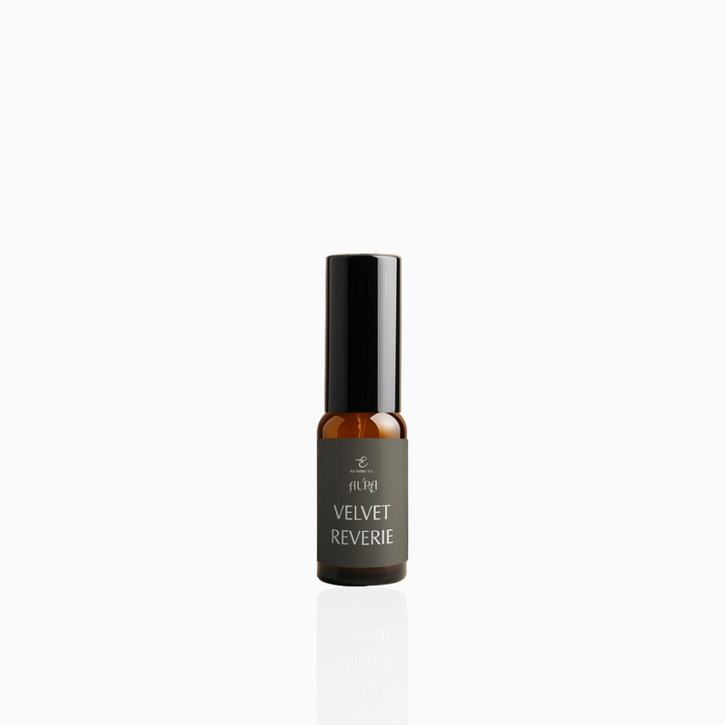 15ml Velvet Reverie fragrance mist in amber glass bottle with black cap and deep grey label, photographed on white background