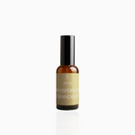 50ml Whispers of Grandeur fragrance mist in amber glass bottle with black cap and muted gold label, photographed on white background