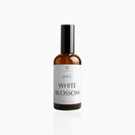 100ml White Blossom fragrance mist in amber glass bottle with black cap and clean white label, photographed on white background