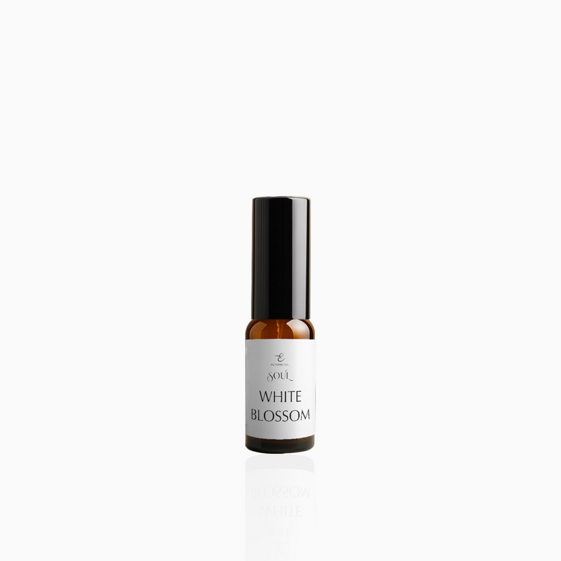 15ml White Blossom fragrance mist in amber glass bottle with black cap and clean white label, photographed on white background