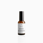 50ml White Blossom fragrance mist in amber glass bottle with black cap and clean white label, photographed on white background