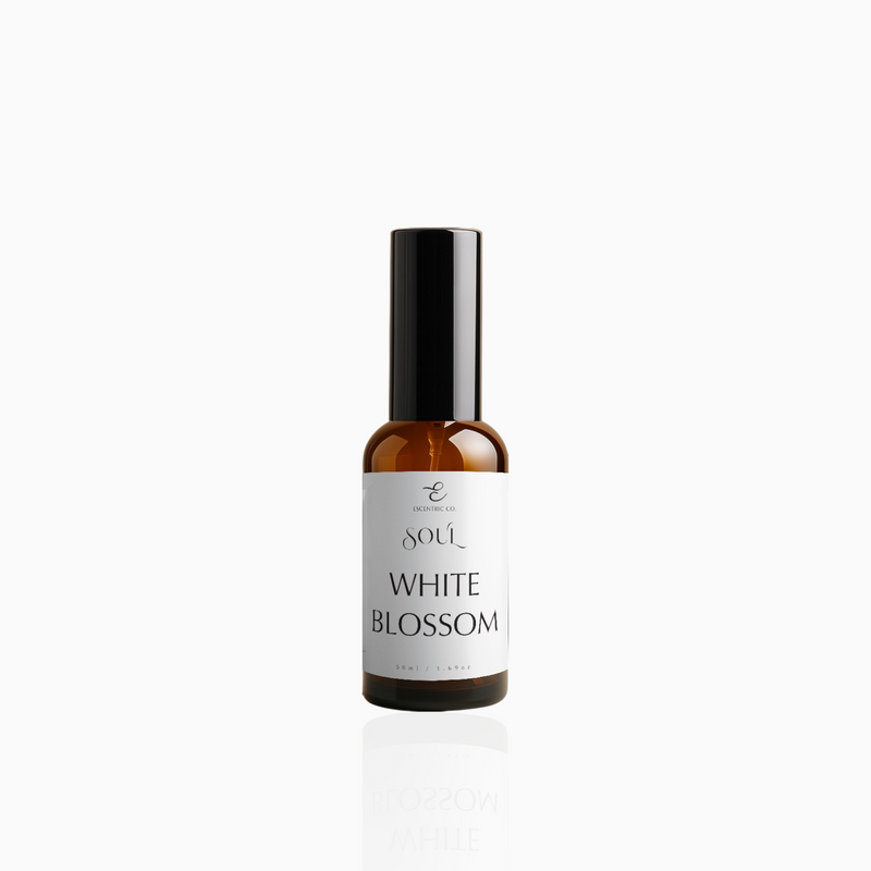 50ml White Blossom fragrance mist in amber glass bottle with black cap and clean white label, photographed on white background